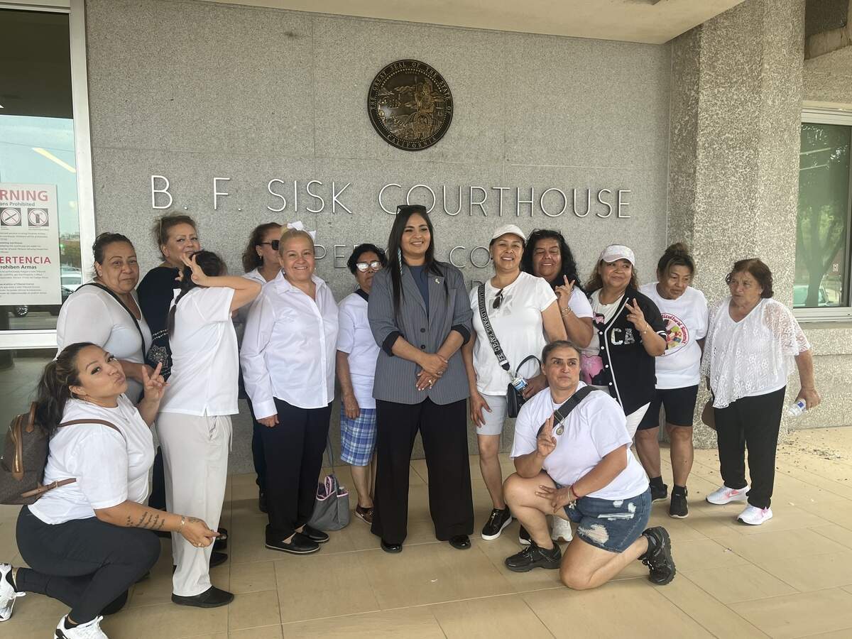 Kerman Mayor Maria Pacheco, center in dark top, poses with fellow Measure S supporters, after a hearing on Aug. 28, 2026, at the B.F. Sisk Courthouse in downtown Fresno.
